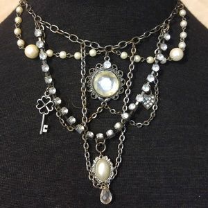 Drop choker necklace w/ rows of charming delight